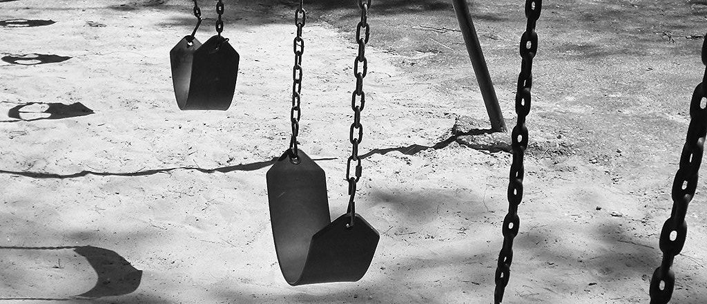 Empty swings representing antinatalism