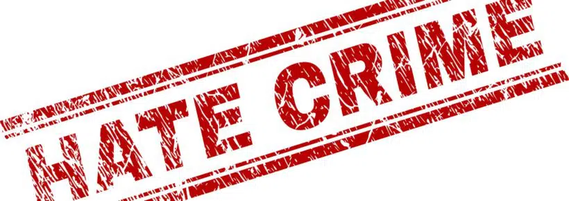 HATE CRIME seal print with distress texture. Red vector rubber print of HATE CRIME caption with dust texture. Text title is placed between double parallel lines.