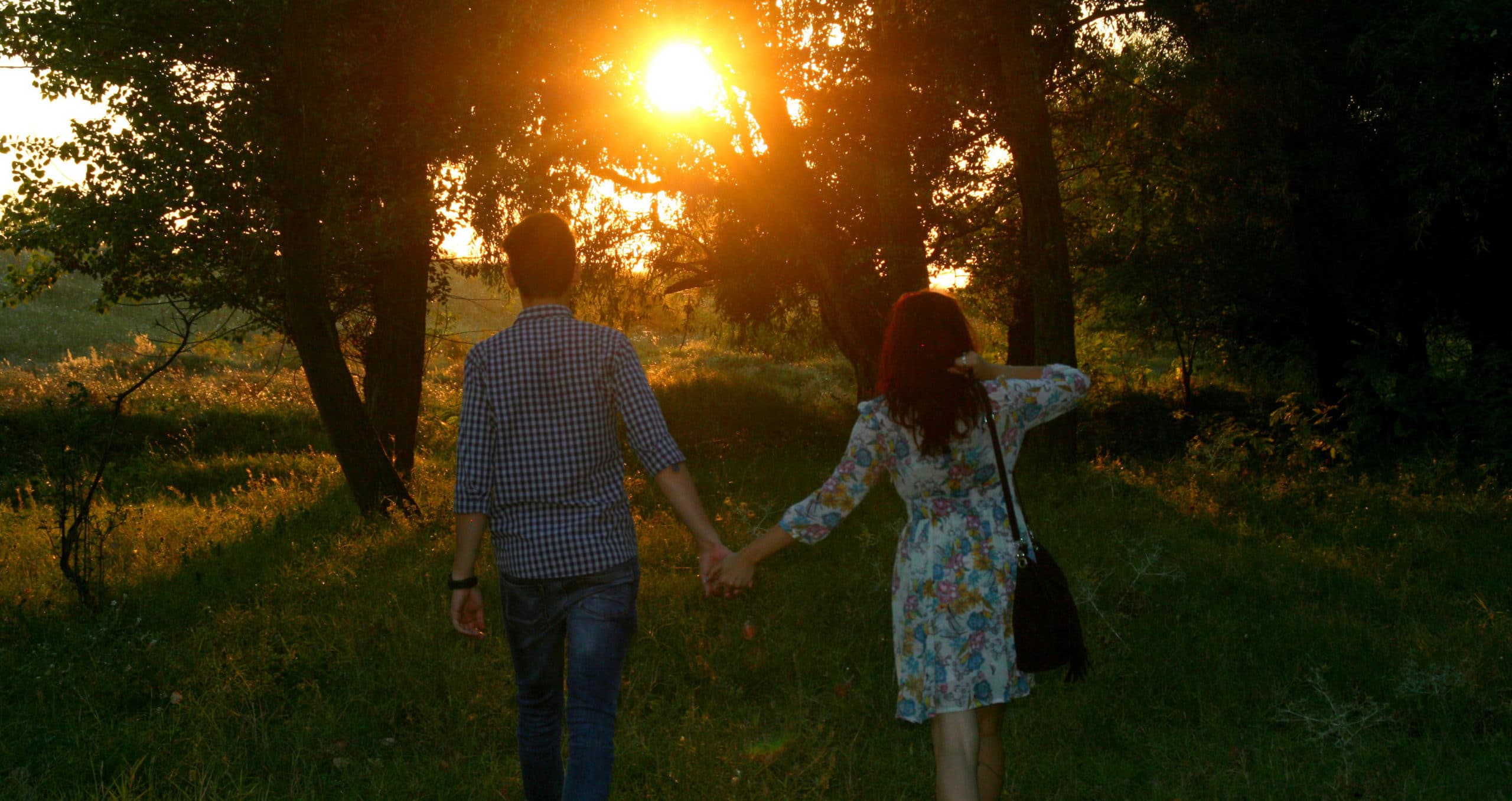 couple walking at sunset