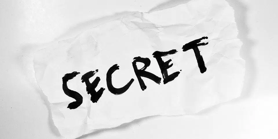 the word secret written on paper