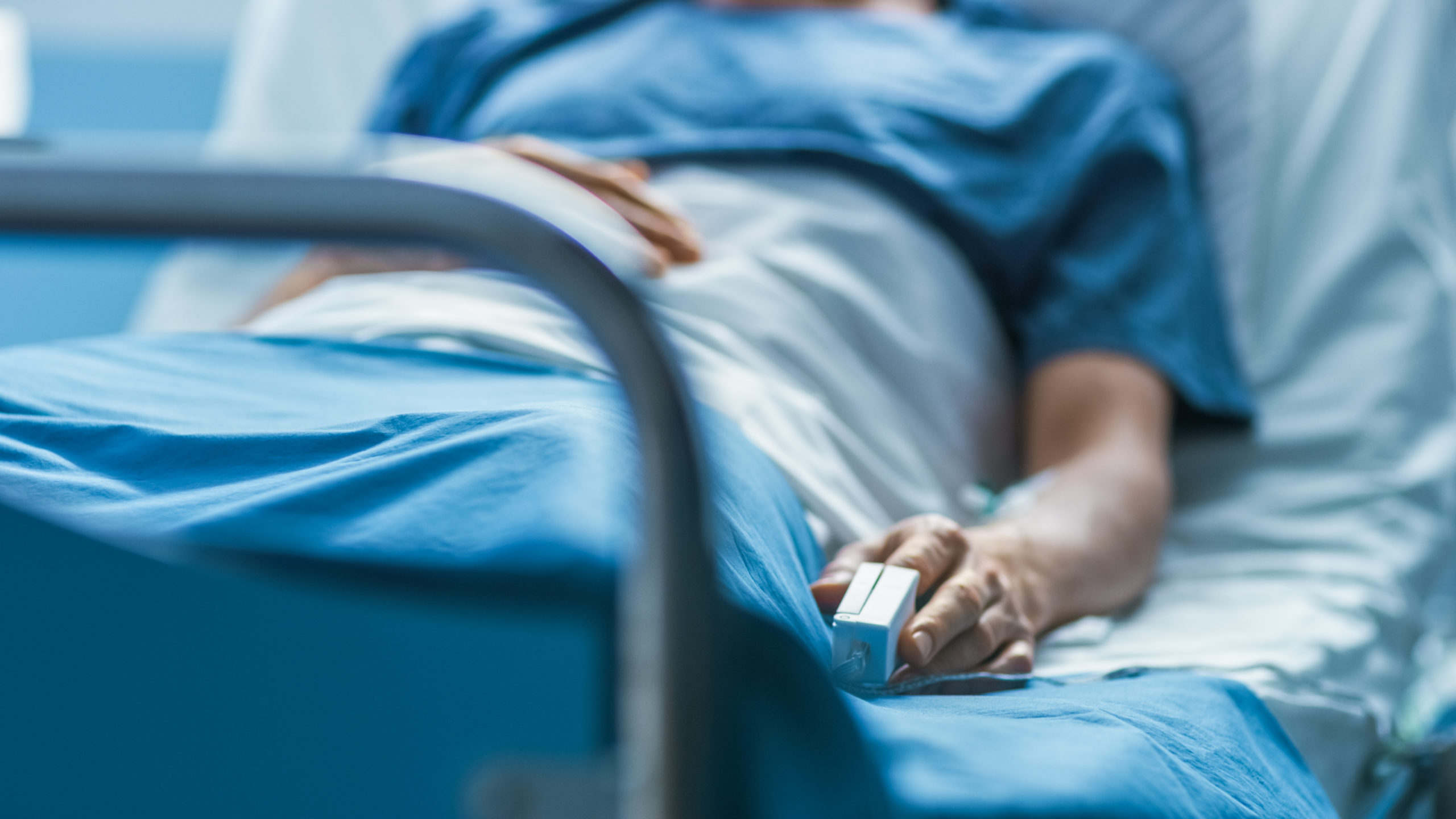 patient in hospital bed, sick