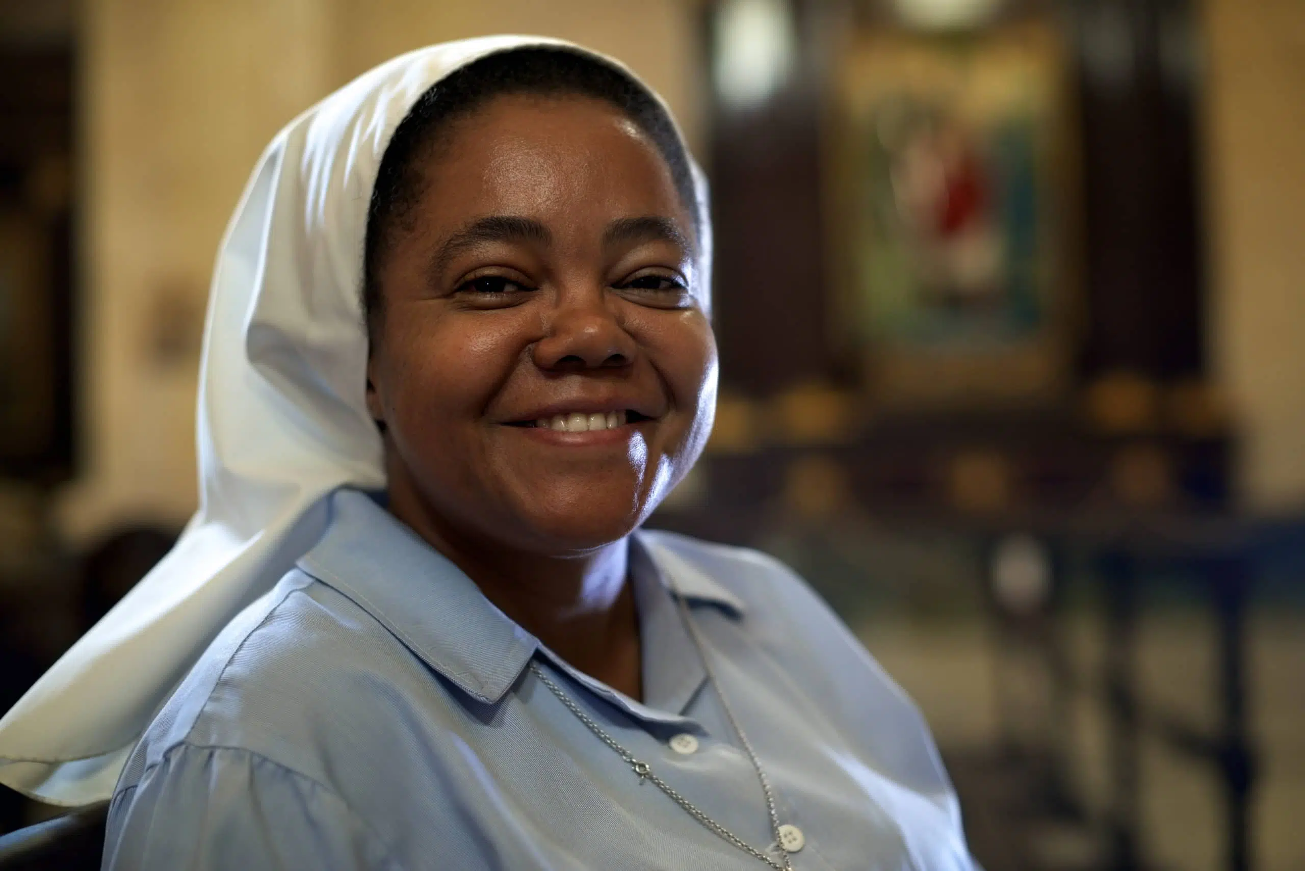 Religious sister, portrait of catholic nun in church