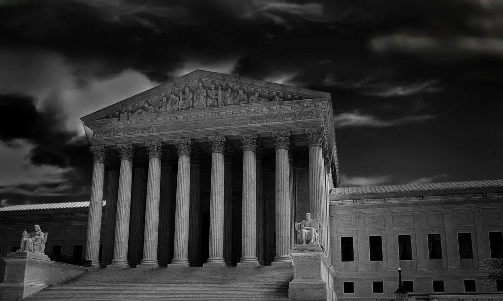 The US Supreme Court in Washington DC with dark storm clouds