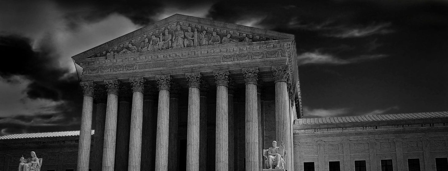 The US Supreme Court in Washington DC with dark storm clouds