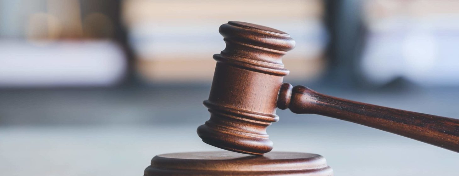 Judge's gavel on table in office