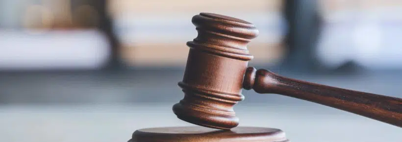 Judge's gavel on table in office