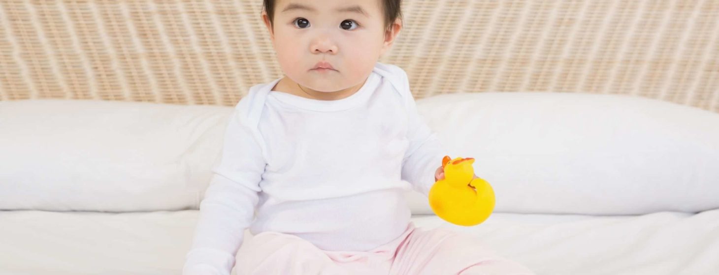 chinese baby girl with rubber duck