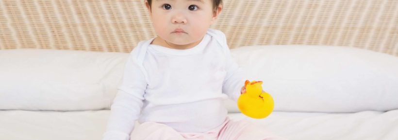 chinese baby girl with rubber duck