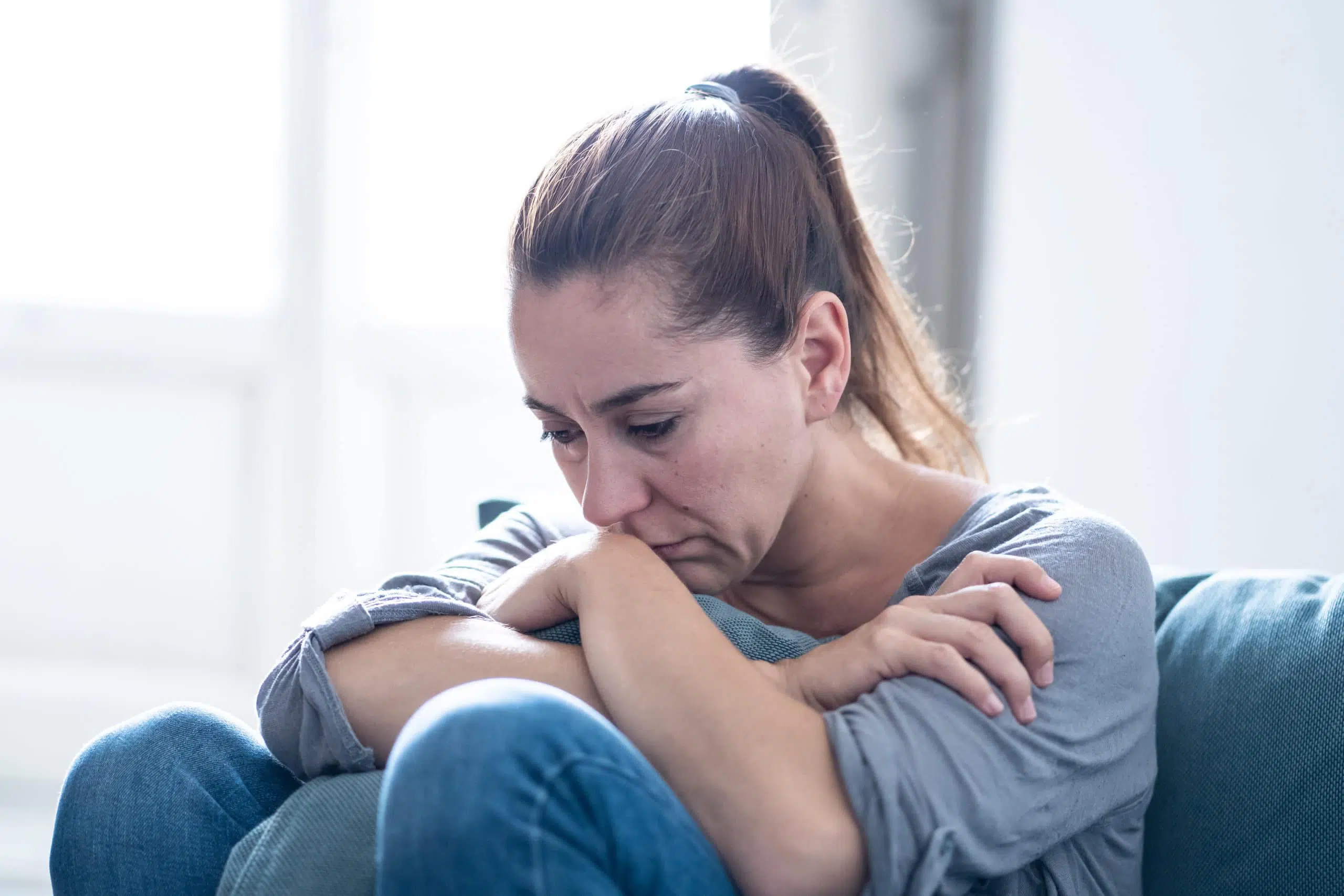 woman upset sad depressed sitting