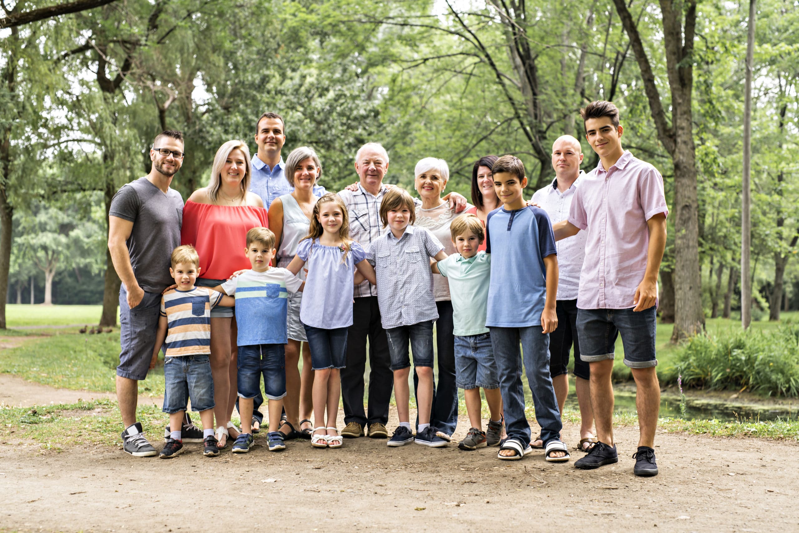 A large family with cousin grandparent father and kid on a forest