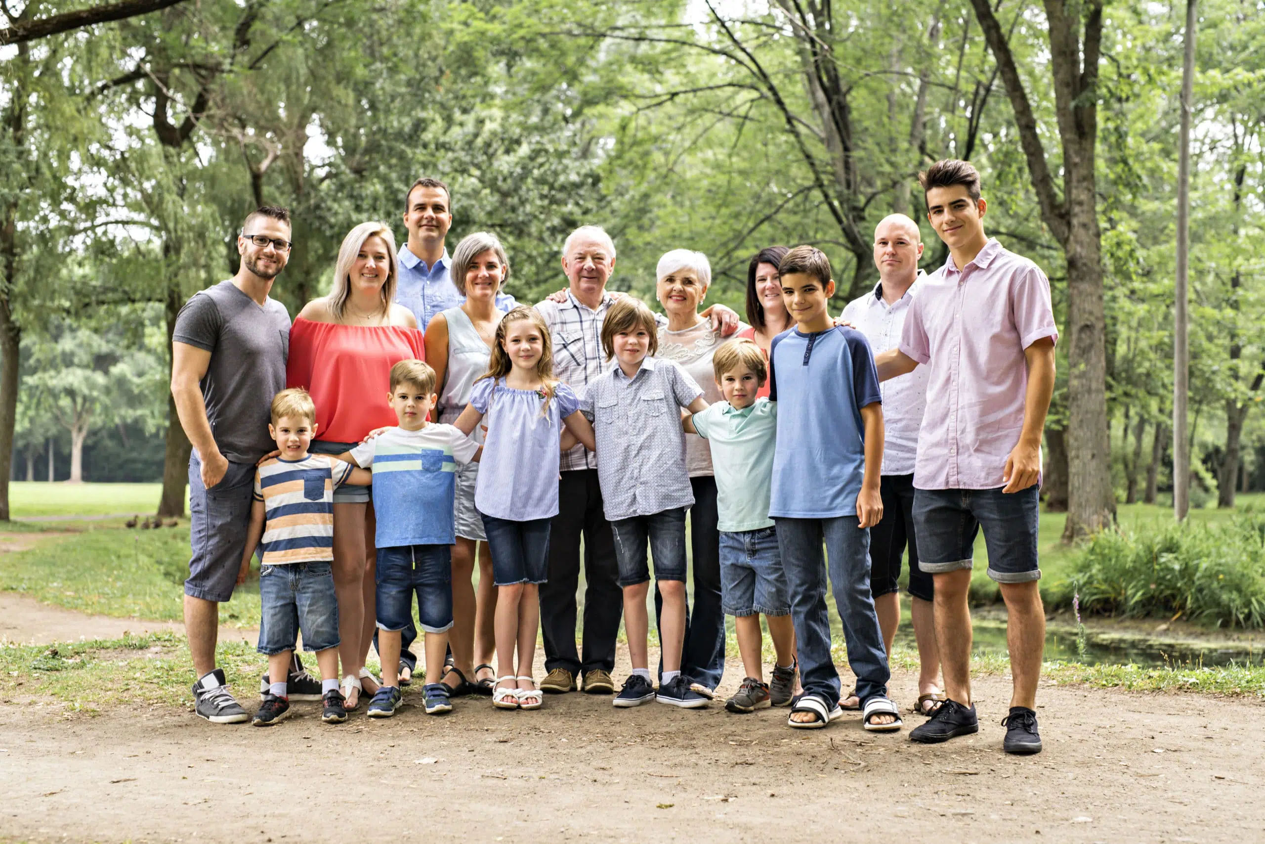 A large family with cousin grandparent father and kid on a forest