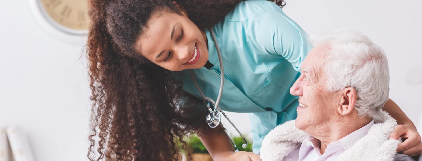 young nurse caring for an elderly man