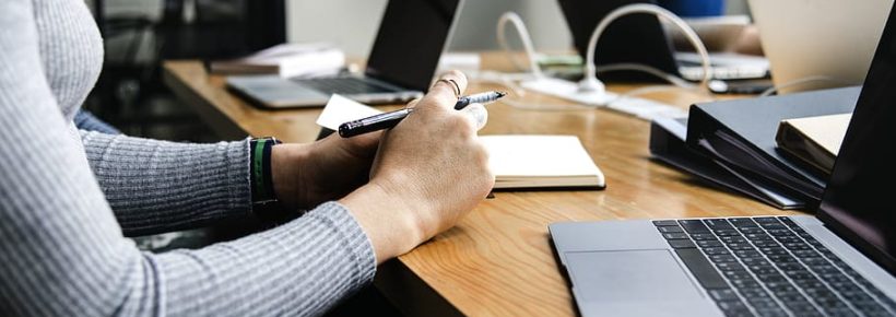 businesswomen in conference room with laptops