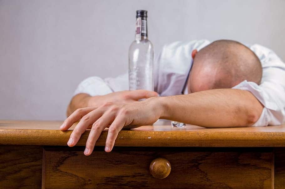 drunk man with empty bottle