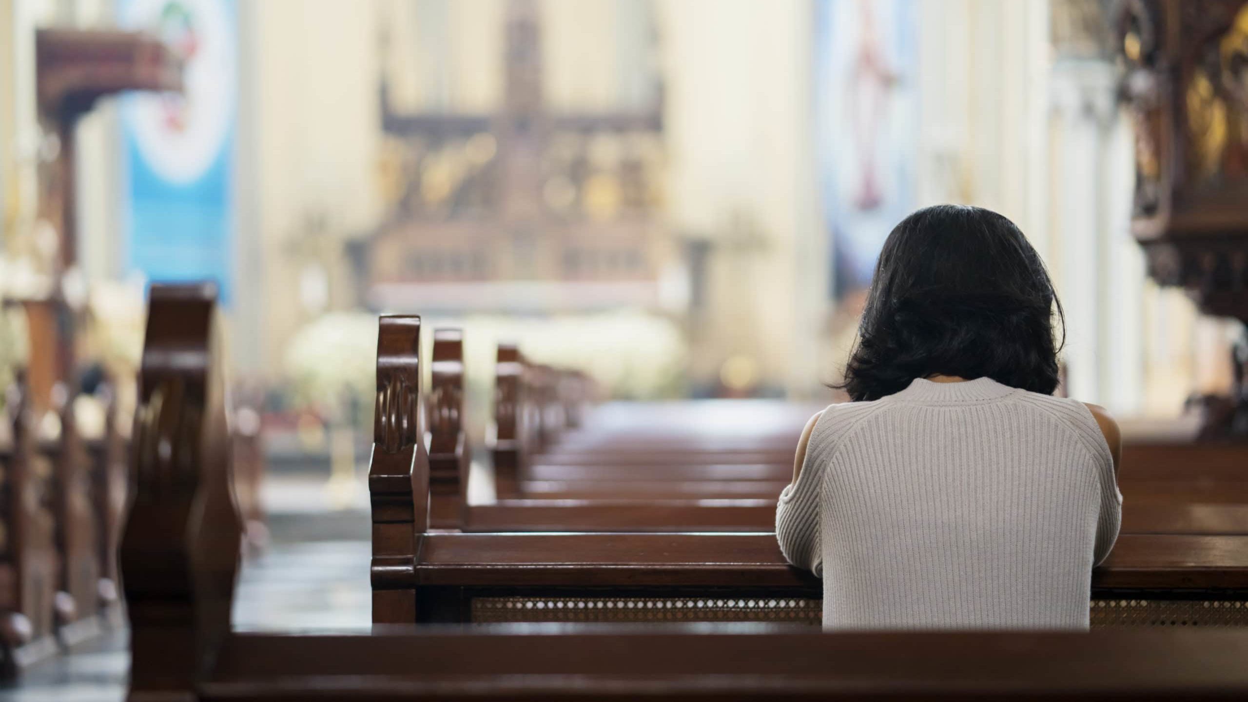 woman praying in church