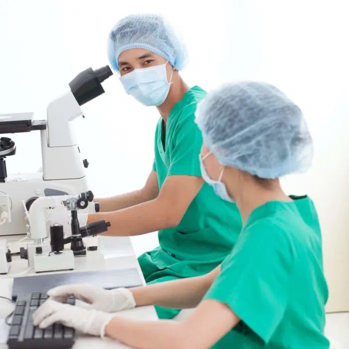 Two scientists doing research in a chemistry lab