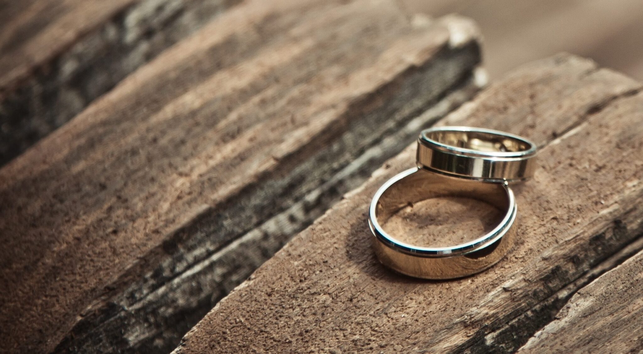 wedding rings on wood