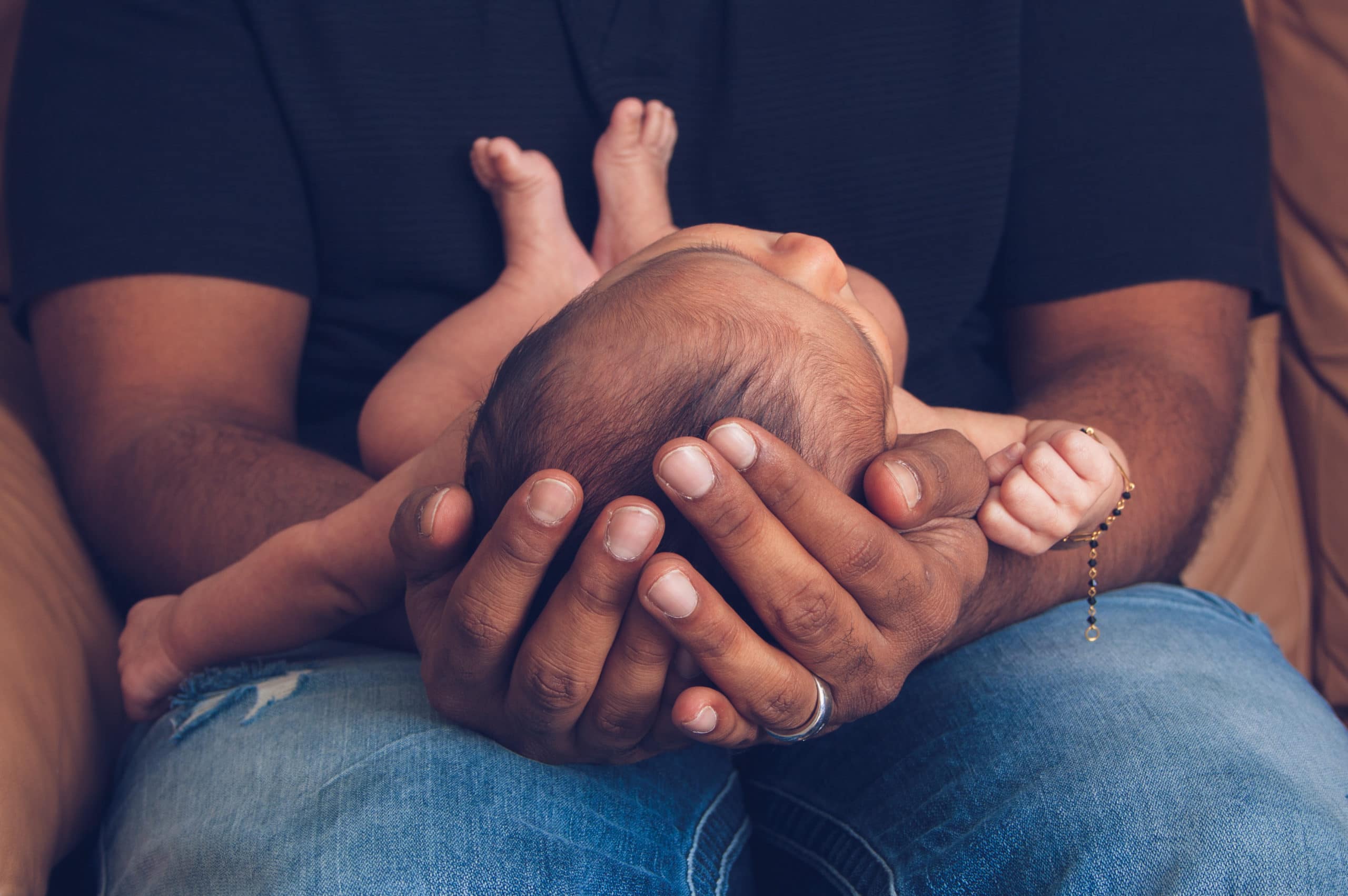 man holding baby 