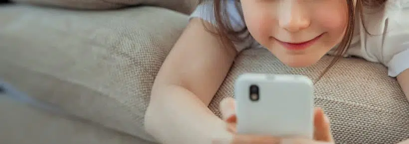 little girl using a phone