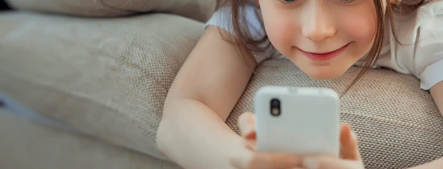 little girl using a phone