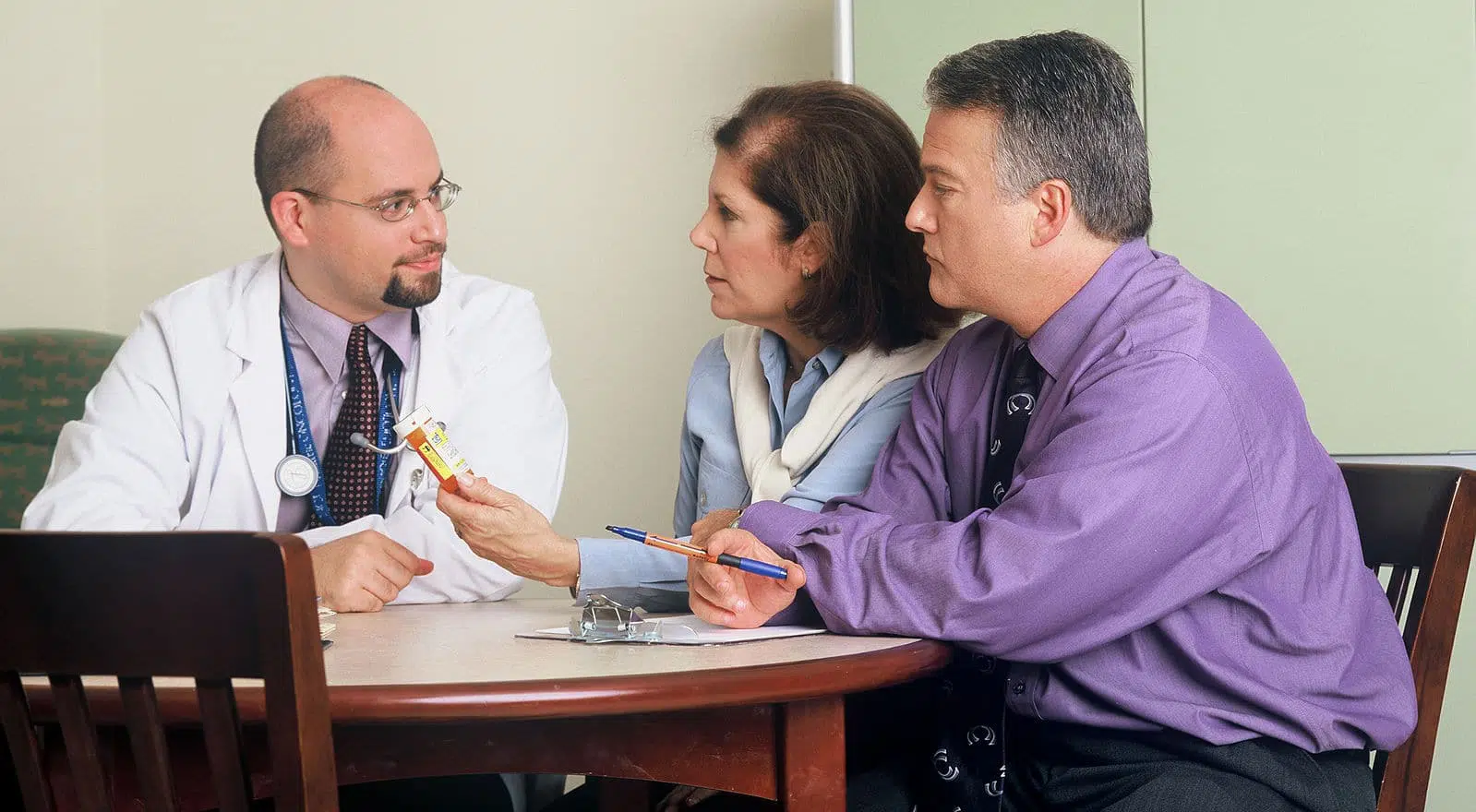 doctor and couple talking