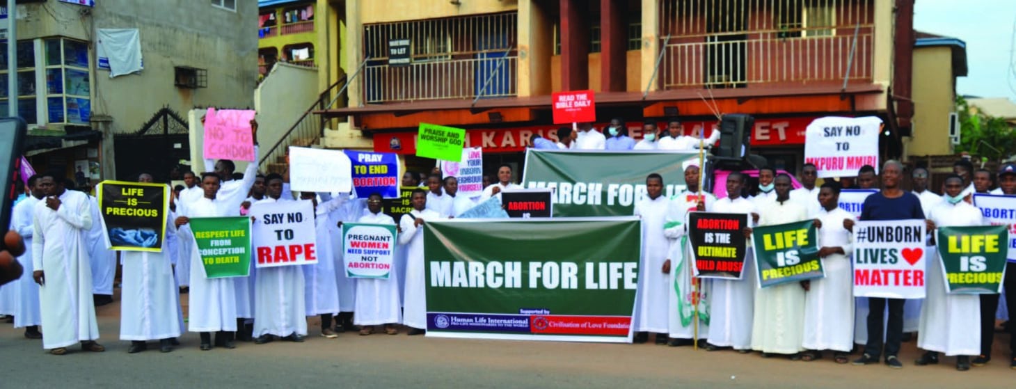 Seminarians marching with signs