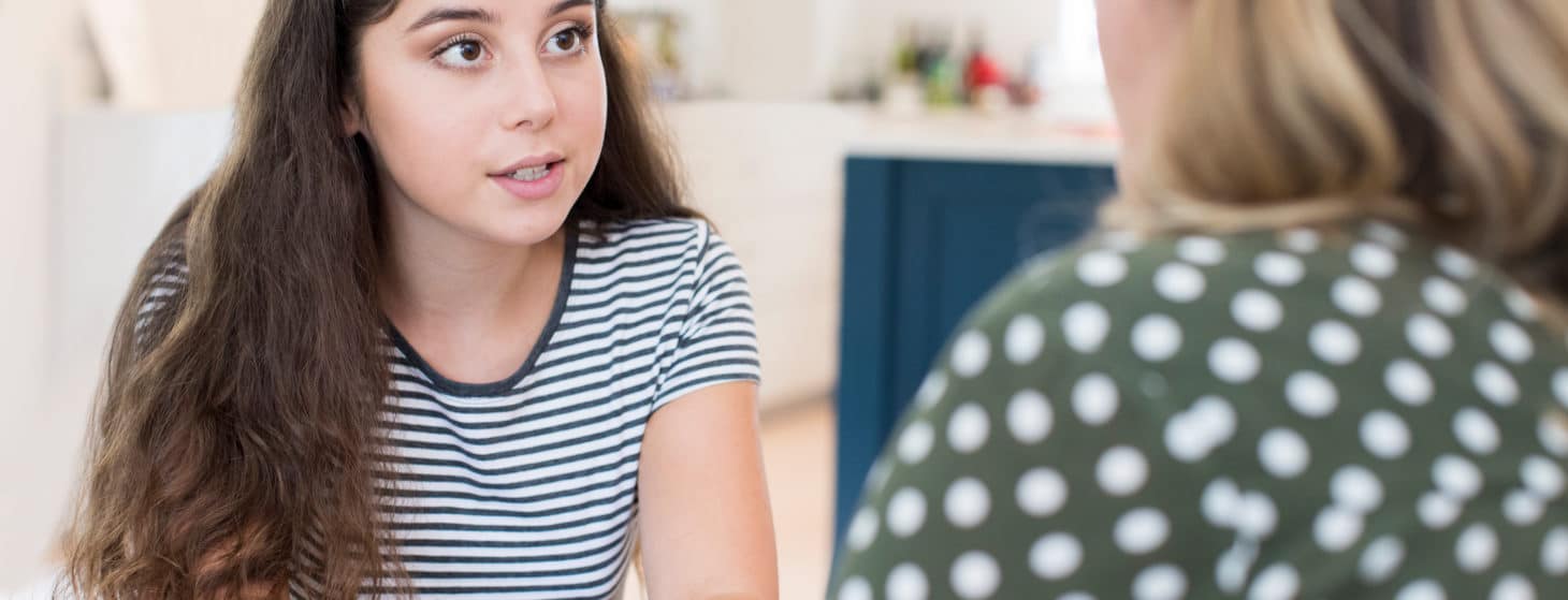 Mother Having Serious Conversation With Teenage Daughter At Home