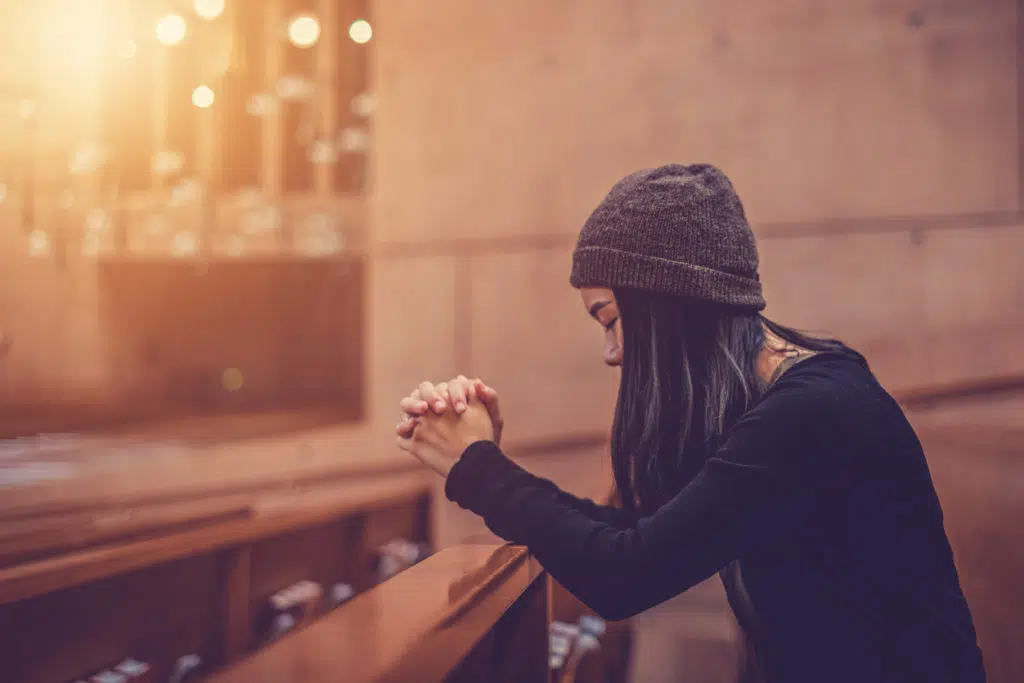 woman praying in church