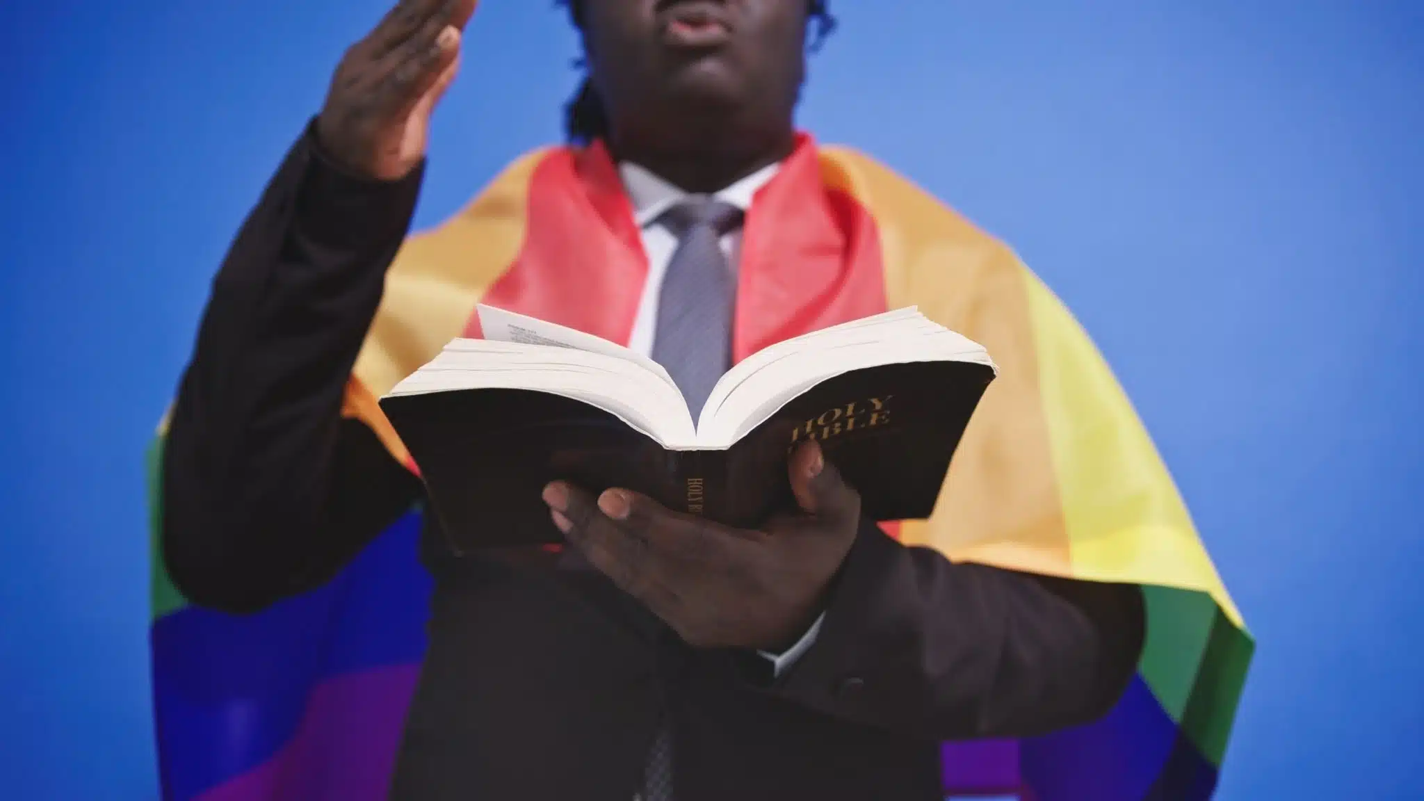 pro-LGBT man reading the Bible