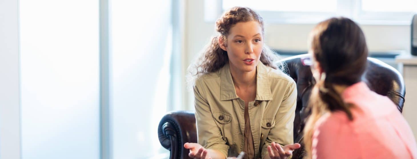 Psychologist having session with her patient in office