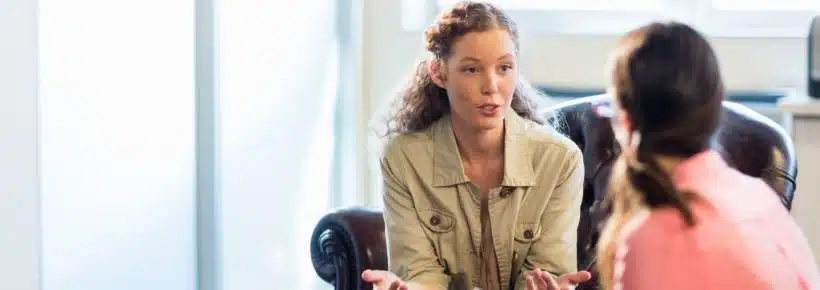 Psychologist having session with her patient in office