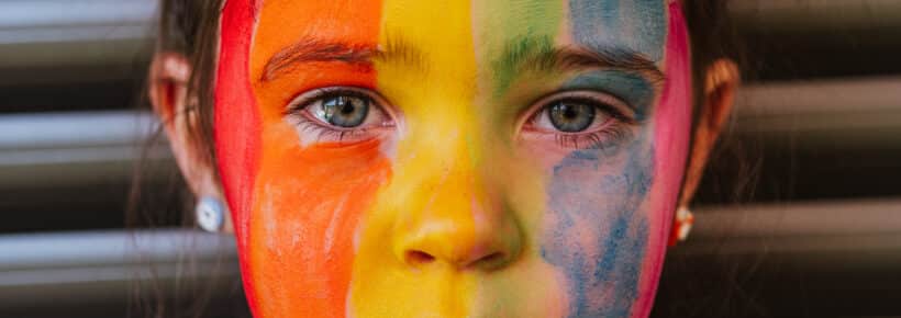 Child with rainbow painted face