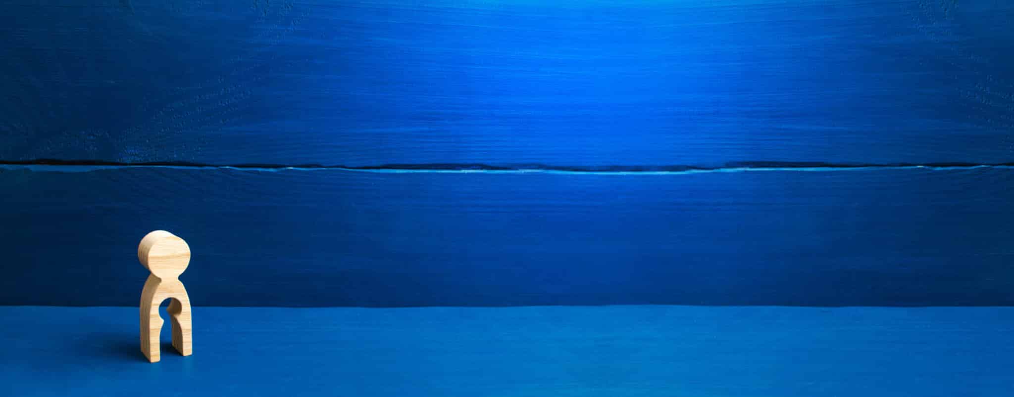 wooden figure of a woman missing a child