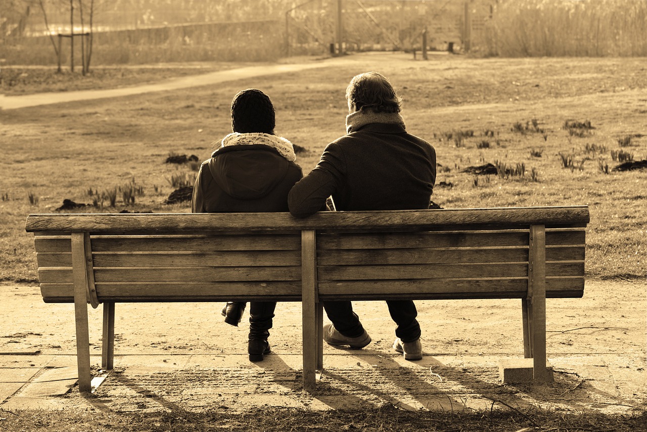 couple sitting on bench