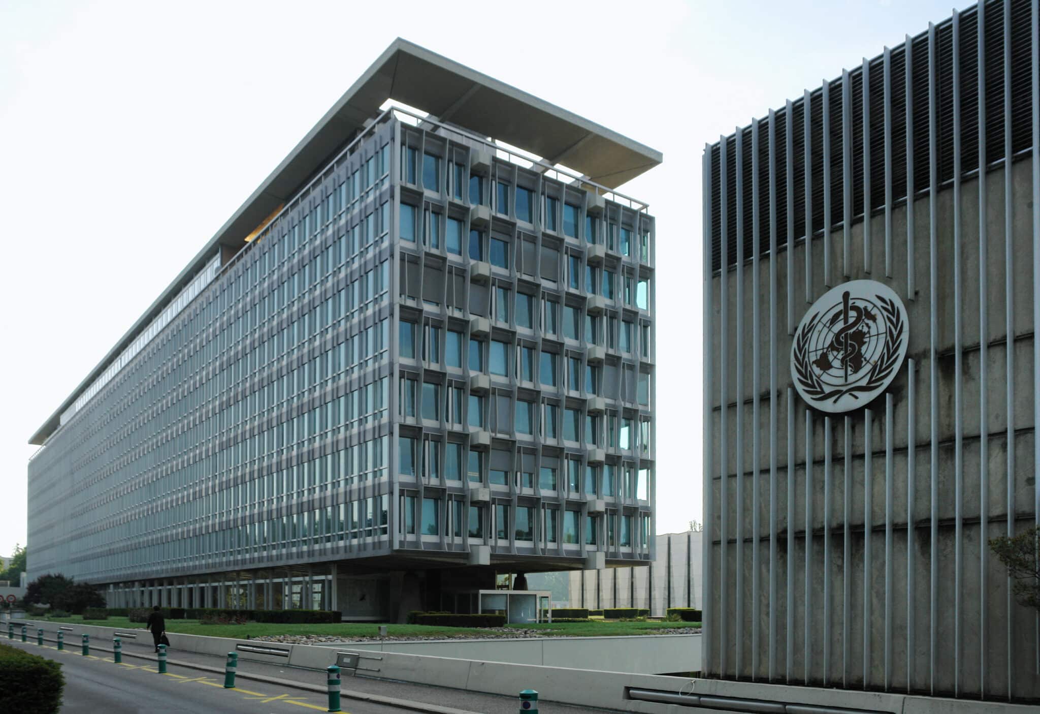 <a href="https://commons.wikimedia.org/wiki/File:World_Health_Organisation_headquarters,_Geneva,_north_and_west_sides_2007.jpg" target="_blank" rel="noopener">"World Health Organisation headquarters, Geneva, north and west sides"</a> by Yann Forget is licensed under the <a href="https://creativecommons.org/licenses/by-sa/3.0/deed.en" target="_blank" rel="noopener">CC Attribution-Share Alike 3.0 Unported License</a>.