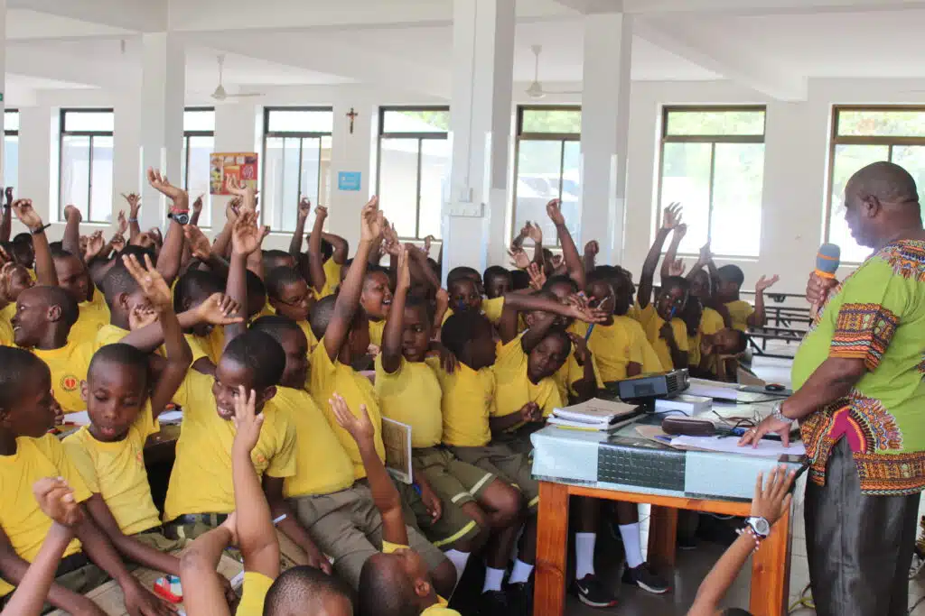 African school children listening to a presentation on chastity and morals