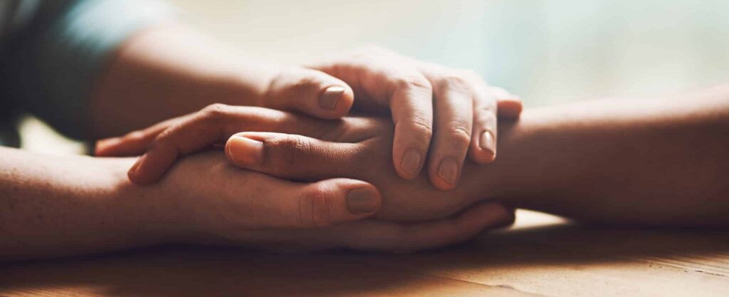 closeup of hands, comfort and empathy