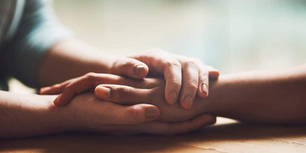 closeup of hands, comfort and empathy